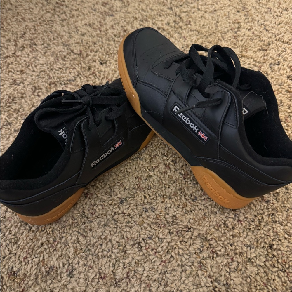 Black Reebok sneakers.
